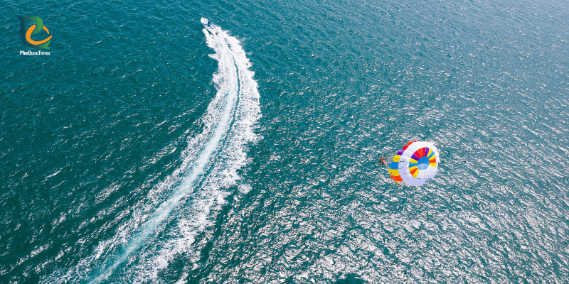 Parasailing adventure at Sao Beach Phu Quoc with speedboat on the sea