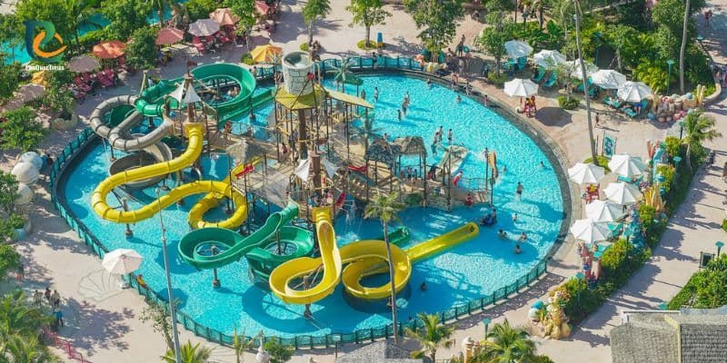 Aquatopia Water Park in Hon Thom Phu Quoc with colorful slides and a busy swimming pool area