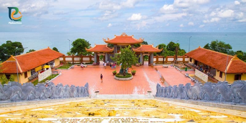 Ho Quoc Pagoda courtyard in Phu Quoc with traditional red-roof buildings facing the sea